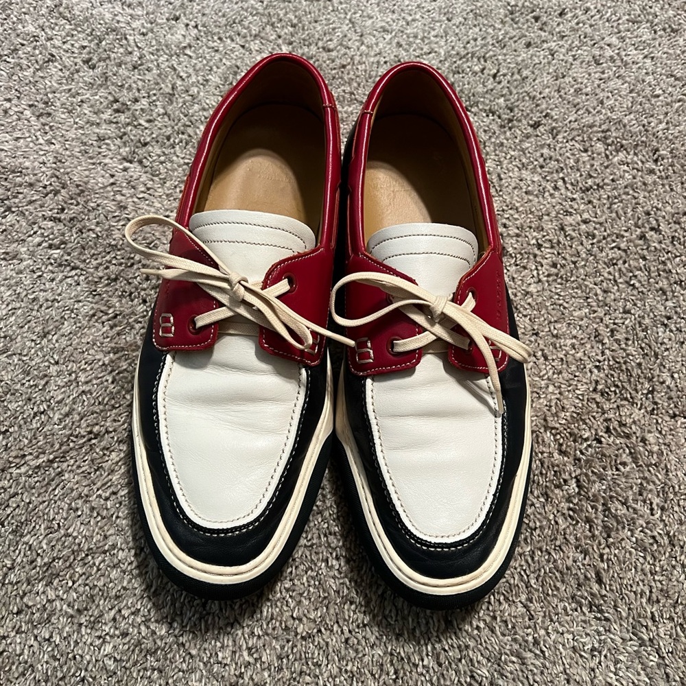 Bally boating shoes in red, white, and blue. They are a size 10